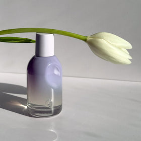 Glossier You Fleur fragrance droplet on skin showing quick absorption and glow