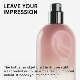 Glossier bottle in hand for size comparison benefit: travel-friendly 50ml