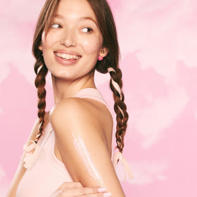 Glow Recipe applying cream on arm to show instant hydration benefit