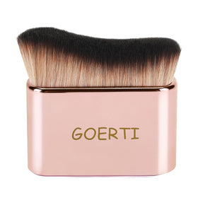 GOERTI front view kabuki body brush showing wide head and rose-gold handle for fast application
