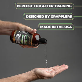 Gold BJJ bottle next to a water bottle showing size and portability benefit