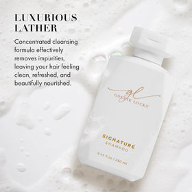Goldie Locks bottle in hand showing 8.45 fl oz scale and travel ease