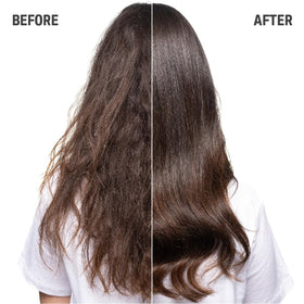 Goldwell Just Smooth bottle in hand for scale showing 300mL size and travel-friendly benefit