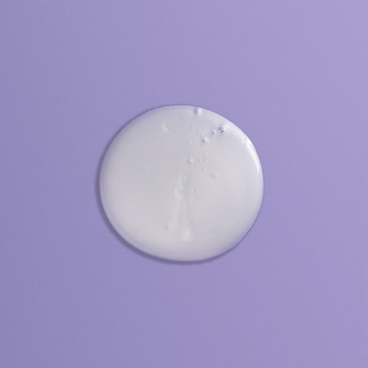 Goldwell Just Smooth bottle in shower scene demonstrating daily use and easy rinsing