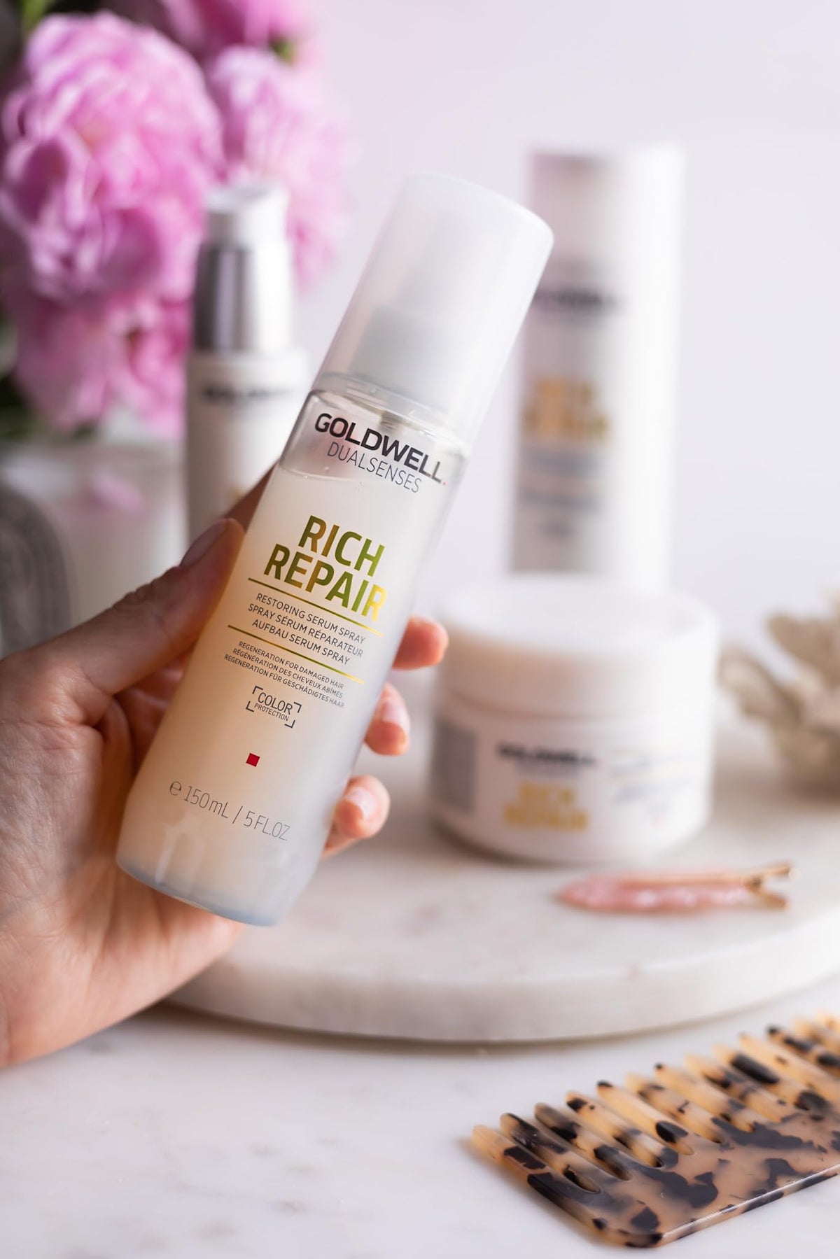 Goldwell lifestyle model with shiny hair after use illustrating restored shine benefit