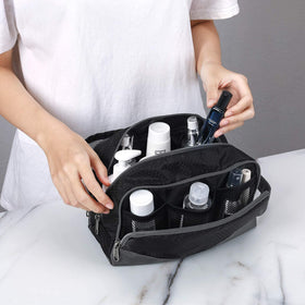 Gonex bag opened and packed with travel shampoo and shaving items