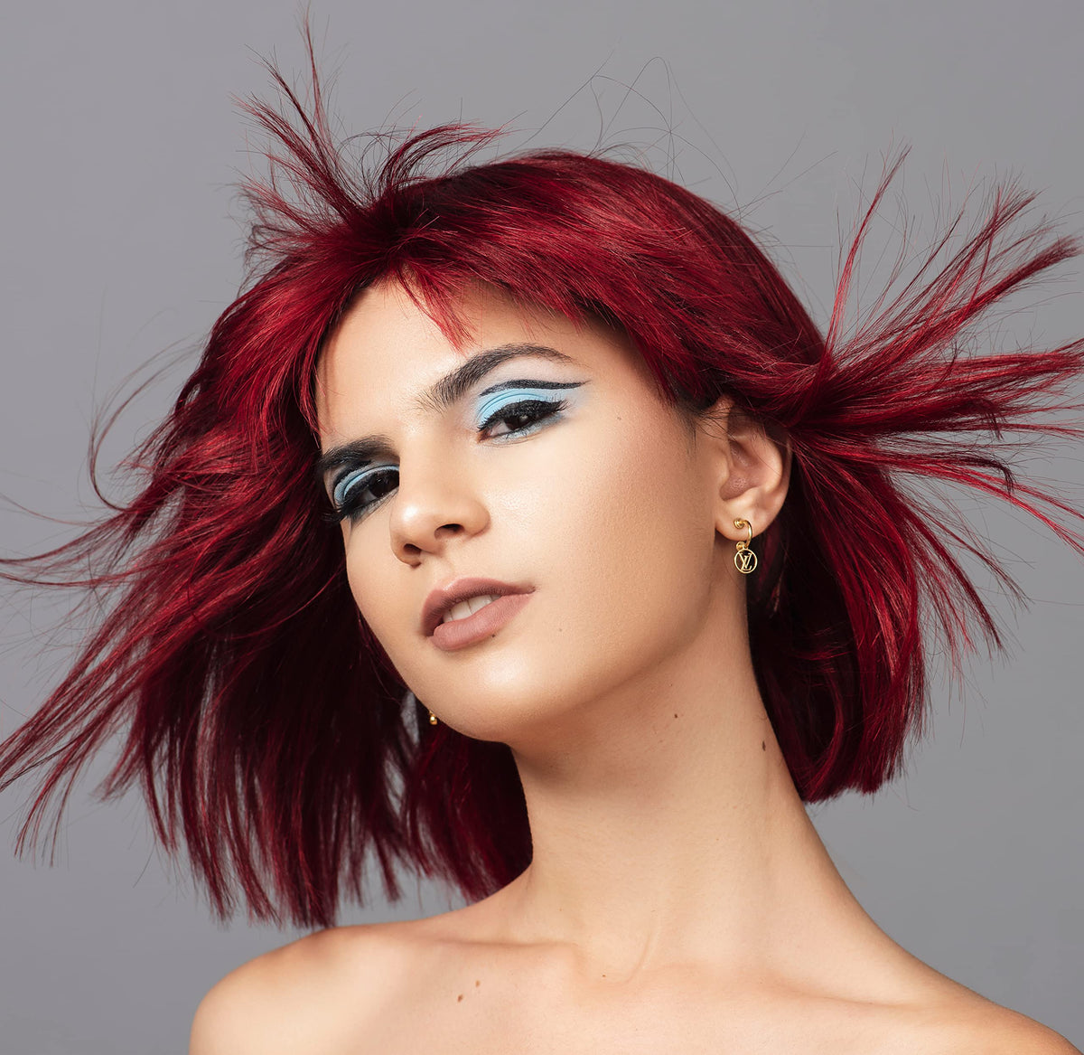 Good Dye Young being applied to hair strand, showing even coverage and conditioning