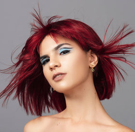 Good Dye Young being applied to hair strand, showing even coverage and conditioning