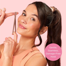 Goody hair tie securing a messy bun demonstrating gentle, damage-free styling