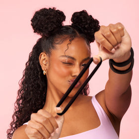 Goody open pack revealing multiple black elastics for convenient extras