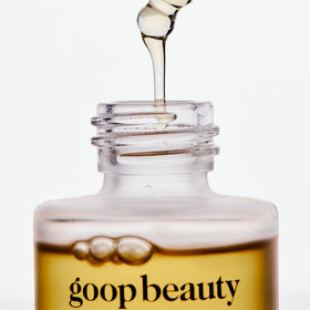 goop applying oil to neck and décolletage for smoother skin