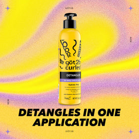 Applying Got2B detangler to damp curls, helps reduce breakage during combing