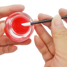 GoWorth brush in use applying lip gloss with precise, hygienic result