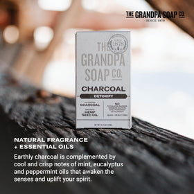 Charcoal bar beside hemp seeds representing organic hemp oil nourishment from The Grandpa Soap Company