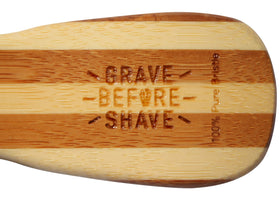 Grave Before Shave brush held in hand for scale, comfortable grip benefit