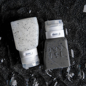 Gravel bottles nested inside a toiletry bag for compact packing