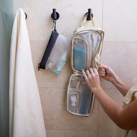 Gravel pouch with travel bottles displayed to show organized packing benefit