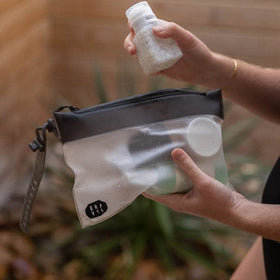 Gravel pouch packed flat inside carry-on for space-saving convenience