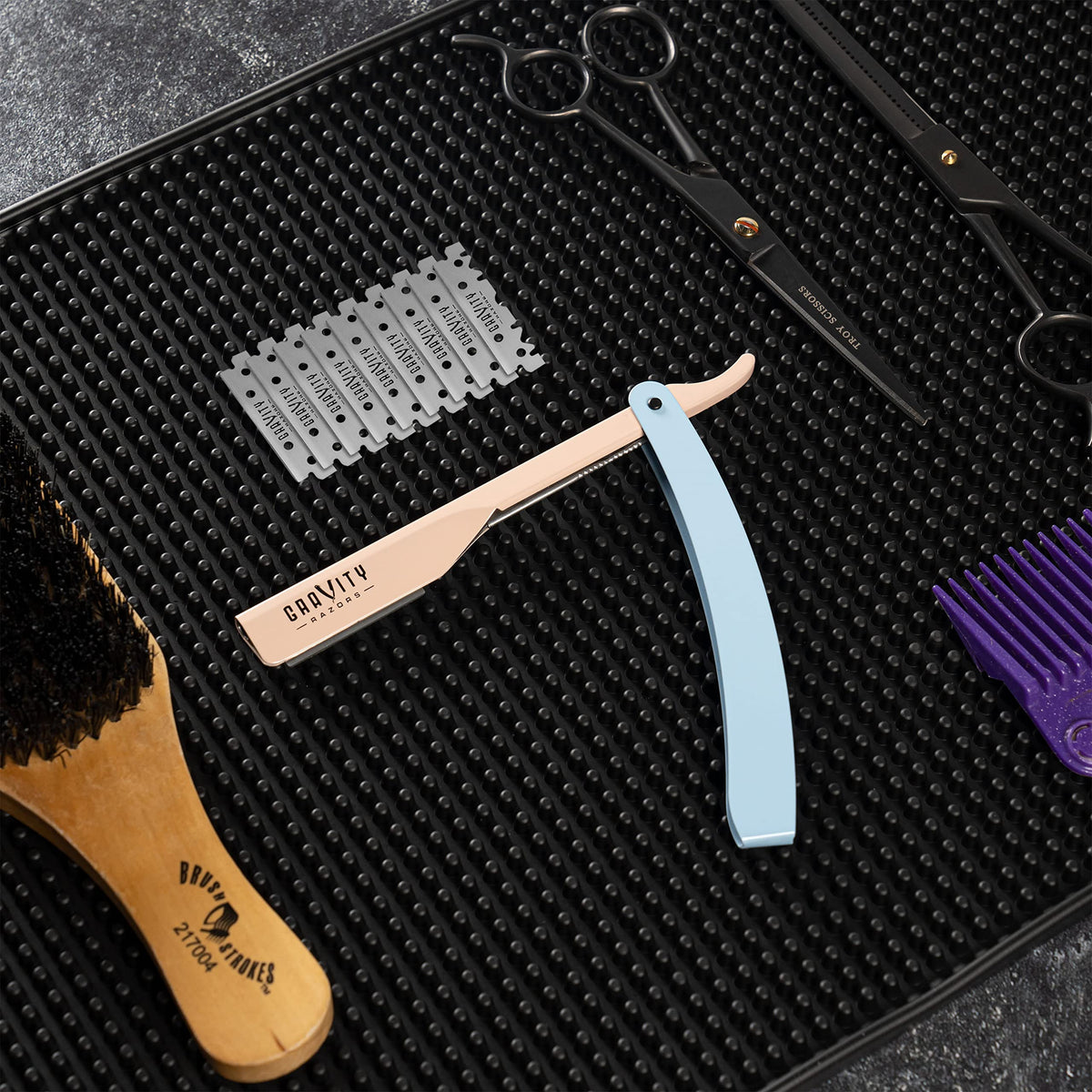 GRAVITY RAZORS open box with 100 blades visible showing bulk convenience benefit