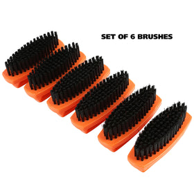 Great Neck brush in hand scrubbing dirt showing ease of use