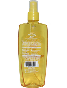 Grisi Manzanilla Gold lotion application closeup on hair demonstrating detangling and lightening benefits