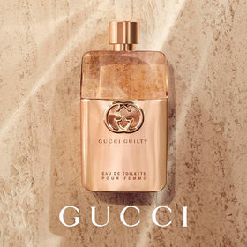 Gucci Guilty fragrance atomized in air conveying fresh aromatic benefit