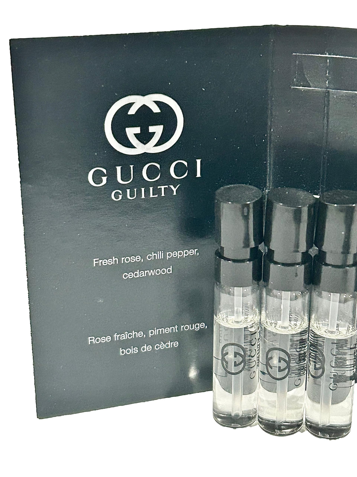 Gucci Guilty vials inside travel bag showing convenience and ready-to-wear luxury on the go