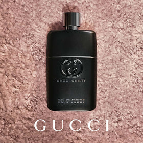 Gucci Guilty being sprayed on wrist demonstrating application benefit