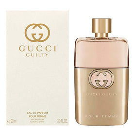 Gucci Guilty packaging and cap close-up highlighting premium finish
