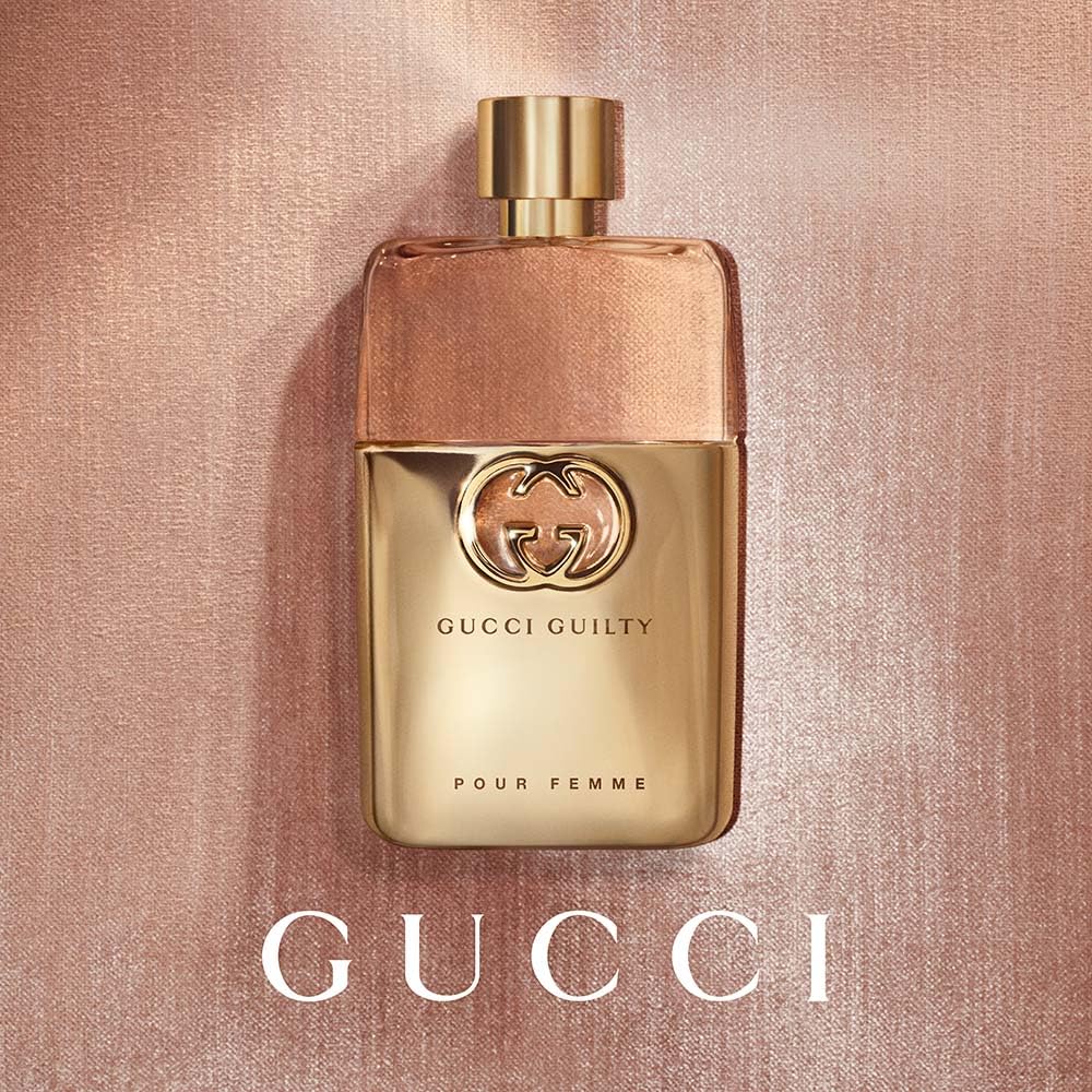 Gucci Guilty side profile of bottle emphasizing label and glass detail