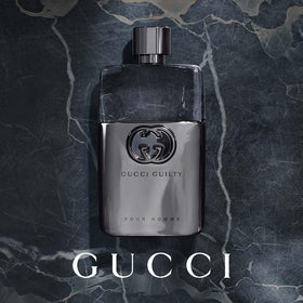 Gucci Guilty spray in hand demonstrating easy application and controlled mist