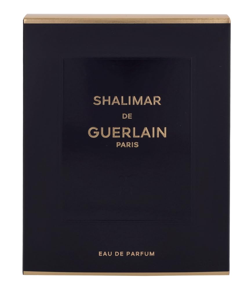 Guerlain Shalimar 3 oz bottle next to ruler for scale benefit: true size reference