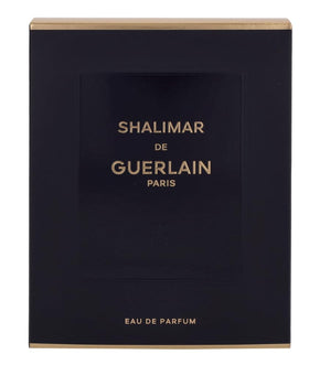 Guerlain Shalimar 3 oz bottle next to ruler for scale benefit: true size reference