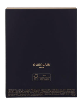 Guerlain Shalimar on vanity with flowers for setting benefit: romantic display idea
