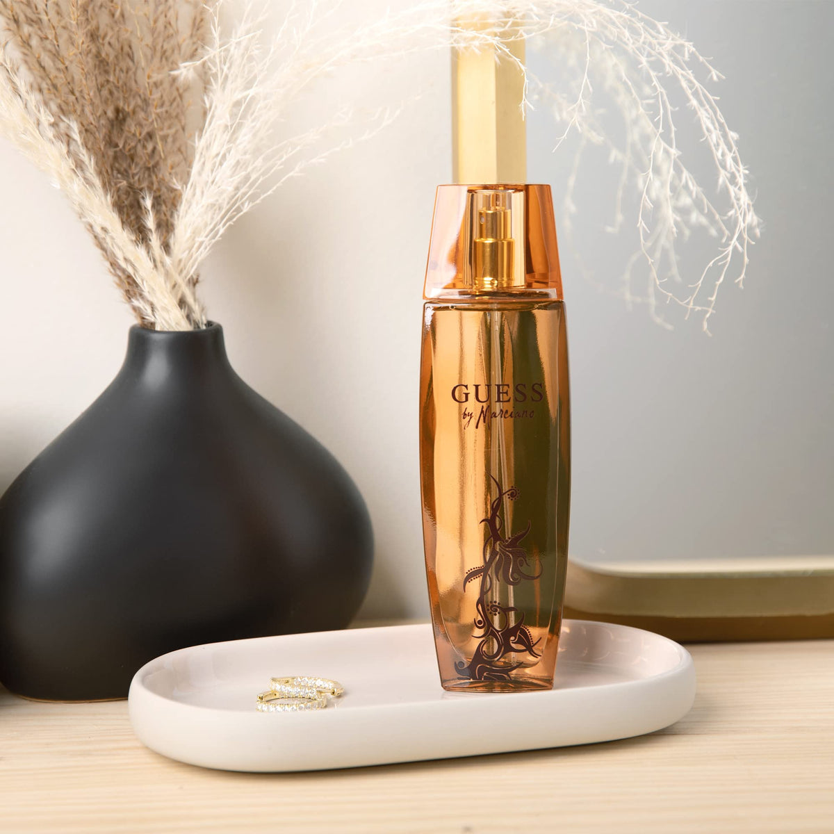 GUESS Marciano spray mist in motion demonstrating fine atomization and easy application