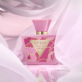 GUESS perfume displayed on vanity with accessories, conveying stylish daily use