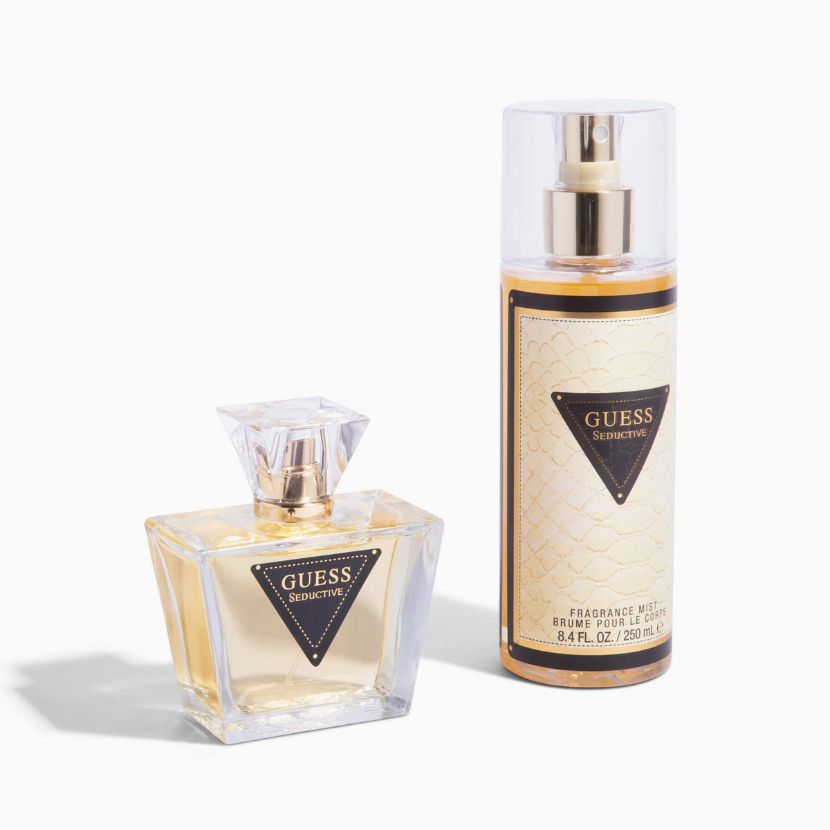 Hand holding Guess bottle to show 75 ml scale and portability