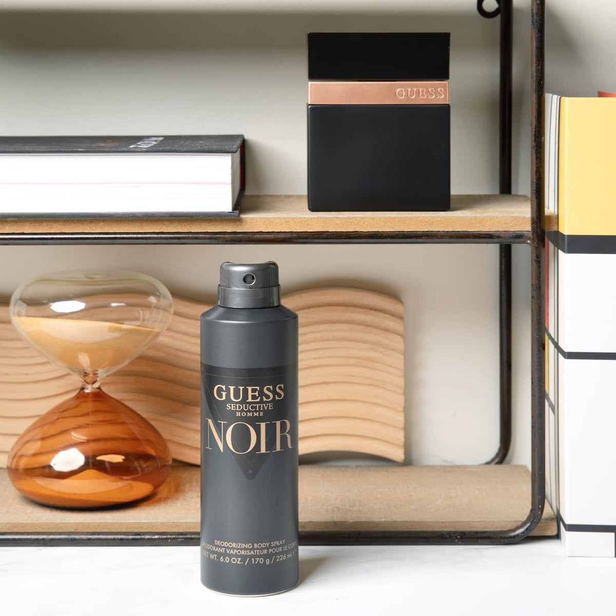 GUESS side profile of bottle highlighting silhouette and premium finish