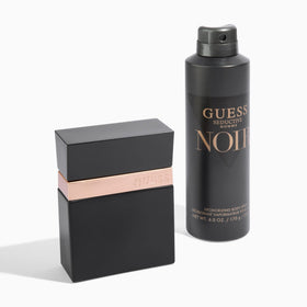 Model applying GUESS Seductive Noir at neck pulse point, brand long-lasting effect
