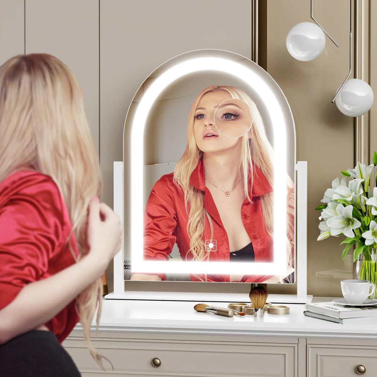 Gvnkvn mirror held in hand to show scale and portability benefit