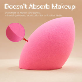 Gold Water Trading pointed-tip sponge being used for concealer precision around eye and nose areas