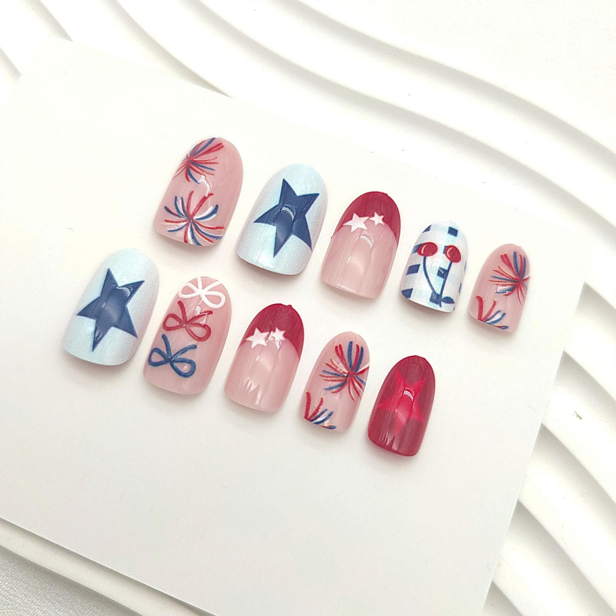 GXOIPNS close-up of glossy bow star and fireworks designs showing crisp detail
