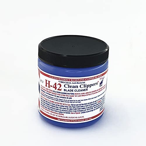 H-42 cleaner applied to clipper blade demonstrating fast debris removal and hygiene
