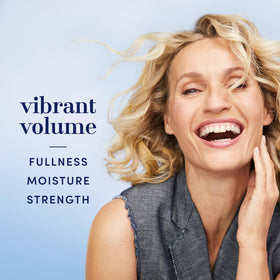 Hair Biology label close-up highlighting biotin and color-safe benefits