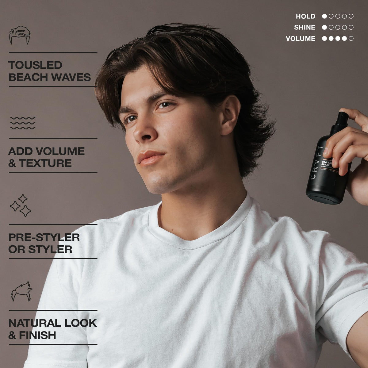 Model using Hair Craft Co. spray to create tousled waves and volume benefit