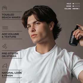 Model using Hair Craft Co. spray to create tousled waves and volume benefit
