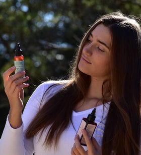 Hair Dance bottle inside a purse lifestyle shot showing convenience for on-the-go refresh