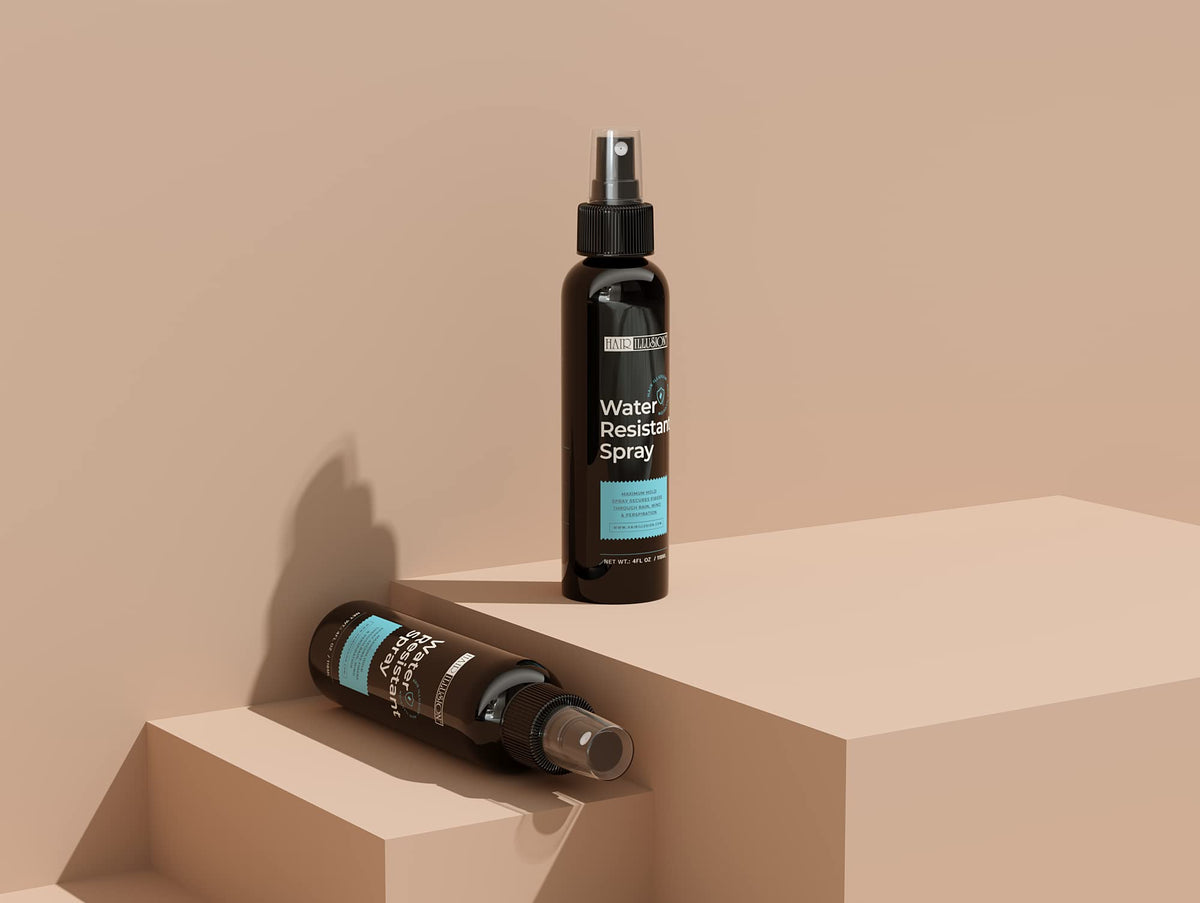 Hair Illusion bottle beside hand to show compact travel-friendly size
