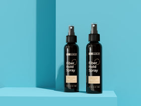 Hair Illusion next to ruler showing 4 oz size for travel-friendly benefit