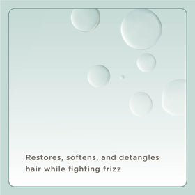 Hand spraying Hairitage leave-in conditioner for quick, even application and detangling